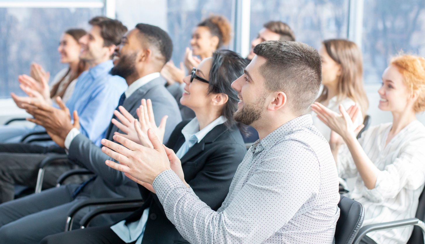 Grateful listeners. Business audience applauding to speaker